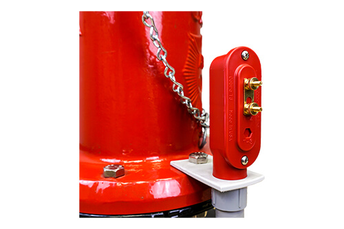 Cobra Hydrant Flange with red terminal on side of fire hydrant