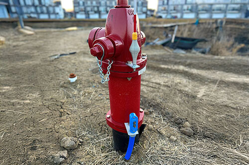 Blue Cobra access point attached to a red fire hydrant