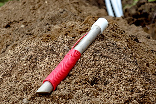 Ground rod laying in dirt