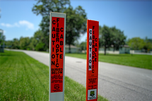 Mamba flat marker post in orange outside in the ground