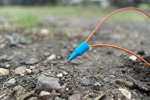 Twist-on connector with orange tracer wire