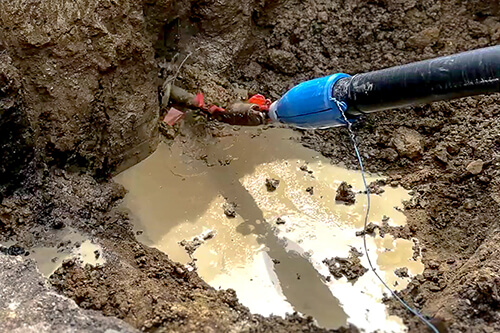 SoloShot Extra High-Strength tracer wire in pipe underground