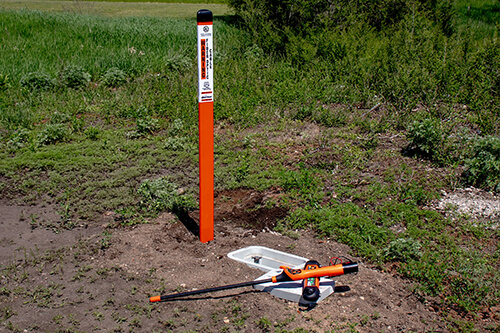 Orange marker post and ViperMag locator on the ground